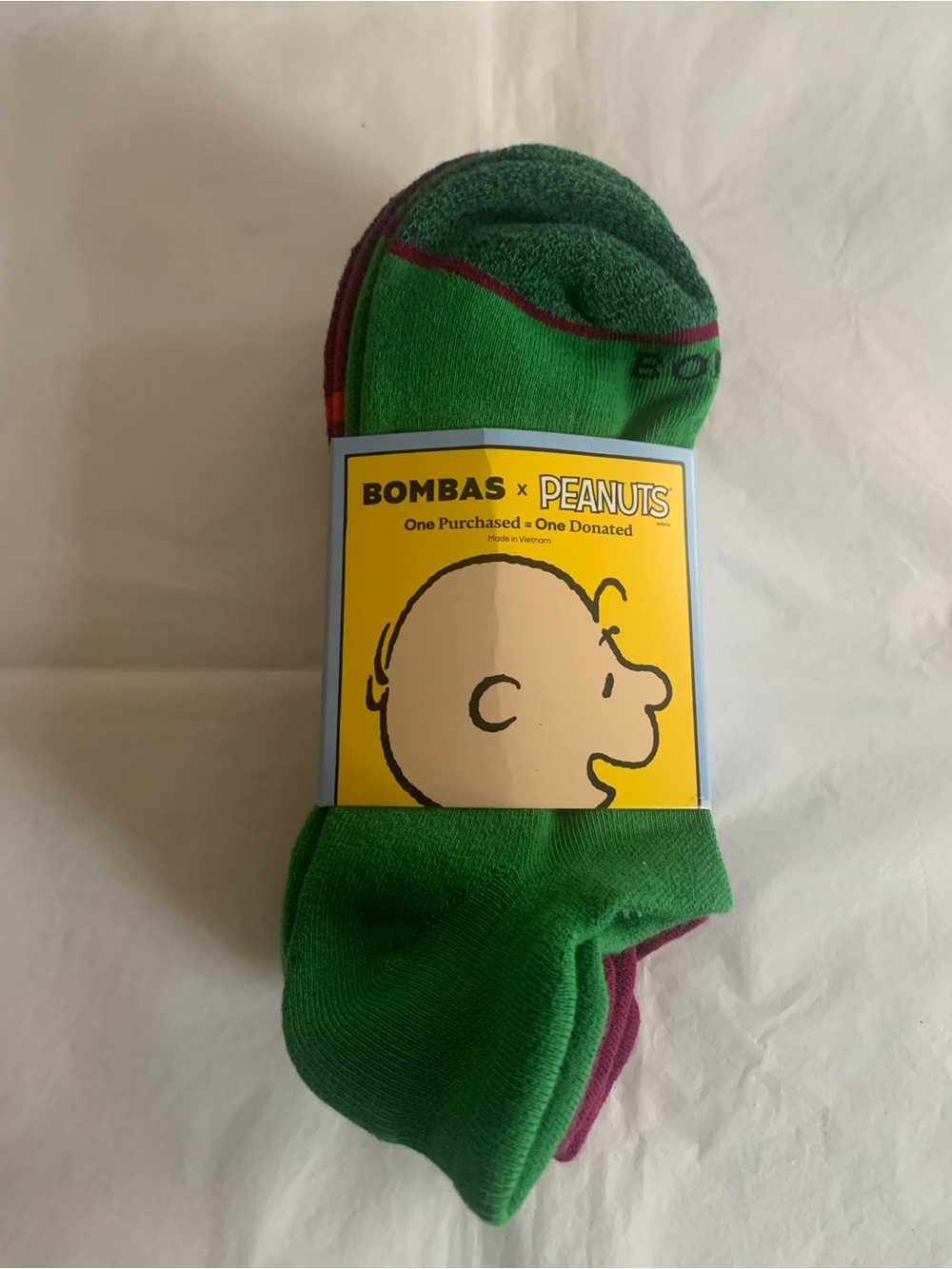 New in package Bombas x Peanuts Crew Socks in Green and Purple